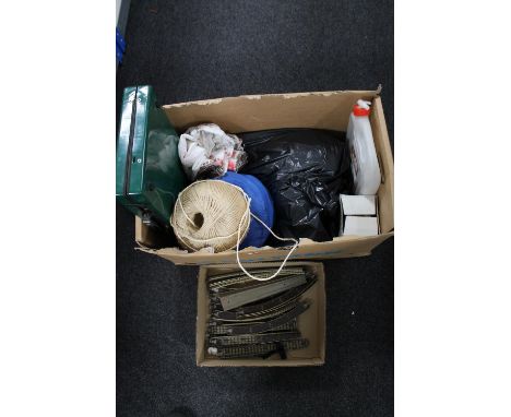 A box containing box of railway track, large ball of string, camping stove, gas lamp etc