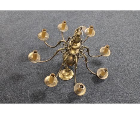 A brass eight-branch chandelier