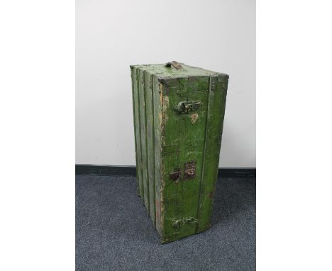An antique green painted shipping trunk
