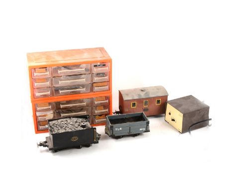 A quantity of Narrow gauge and other spare model railway parts, including spoked wheels, other wheels, metal parts, kit built