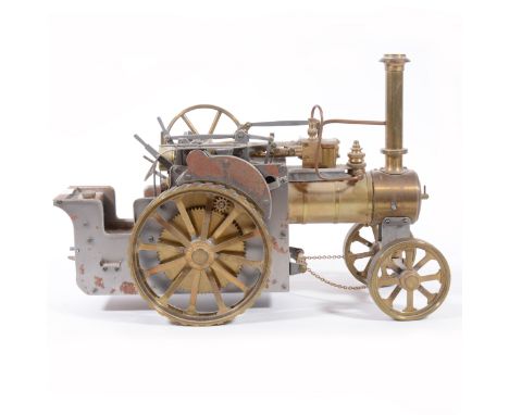 DRM Engineers Birmingham scale model traction engine, brass construction with mechanical flywheel, 30cm length, unpainted.