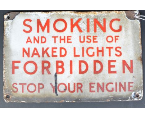A retro vintage 20th Century warning advertising sign having red lettering on white ground reading "Smoking and the use of na