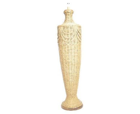 A large retro mid 20th Century 1960s wicker standard lamp light of urn shaped form with swag detailing. Tapering body with al