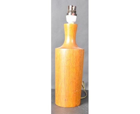 A retro vintage mid 20th Century teak table lamp light of cylindrical tapering form with waisted neck atop. Measures approx; 