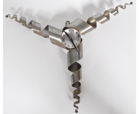 A contemporary coiled steel steampunk made hanging clock of trefoil form having a central circular face with burnt chapter ri