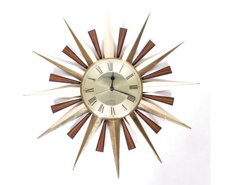 Metamec - An original retro vintage 20th Century sunburst / starburst wall clock by Metamec. Central circular dial with facet