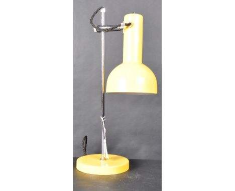 A 1970s Vintage adjustable desk lamp, metal yellow shade with fitted button switch, light has 360 swivel capacity, supported 