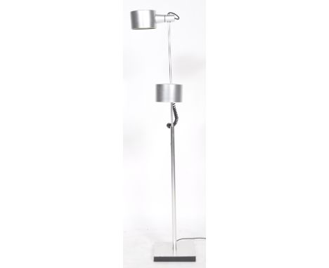 Ronald Homes - Conelight Ltd - A retro 1960s twin floor standing spotlight lamp having a single light above a adjustable cyli