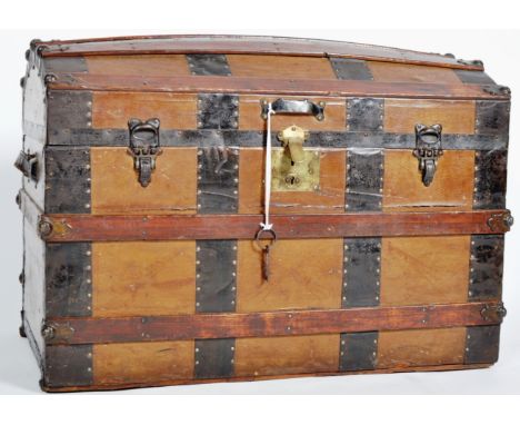A 19th Century Victorian brass and leather bound trunk / steamer chest having a domed lid with detailed leather finish and br