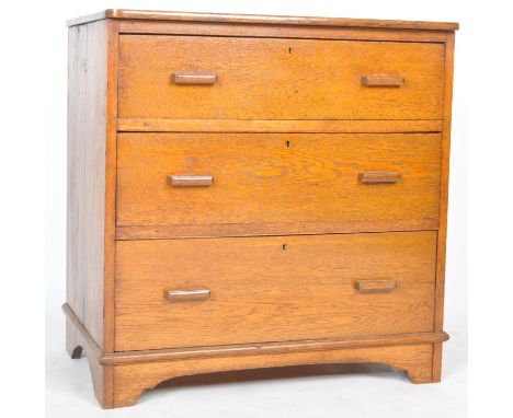 A 20th Century 1940s Air Ministry style oak three drawer chest of drawers having a rounded edge solid oak top with three draw