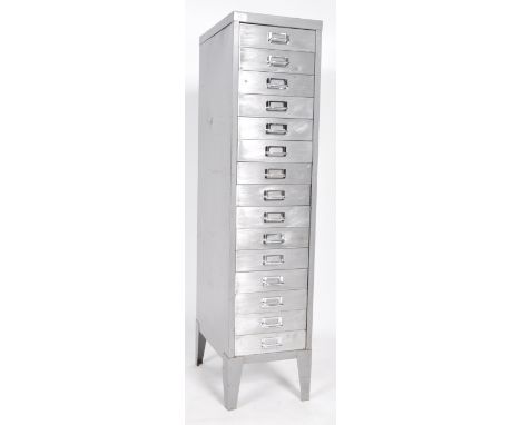 A retro vintage 20th century industrial factory office fifteen drawer filing cabinet with chrome handles, on bracket legs wit