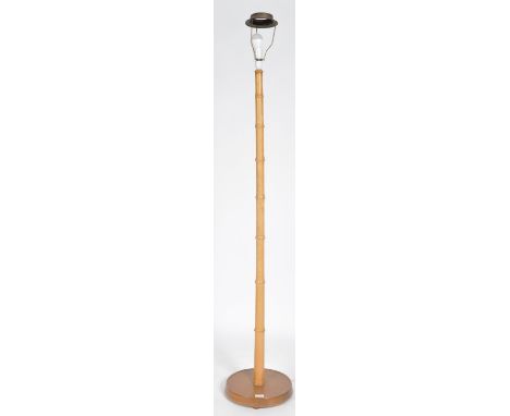 A retro vintage mid 20th Century faux bamboo standard lamp light having a single bamboo stem raised upon a circular teak wood