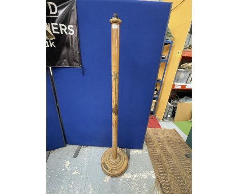 A CARVED WOODEN ORIENTAL STANDARD LAMP 