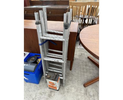 A SET OF LADDERS AND A VINTAGE OIL CAN 