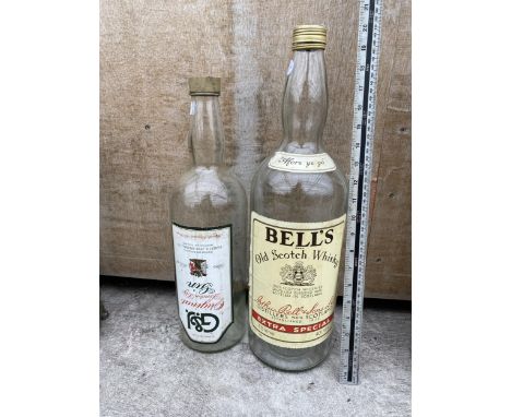 A LARGE BELLS SCOTCH WHISKEY BOTTLE AND A LARGE GIN BOTTLE 