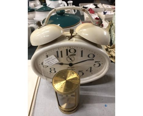 A WEST GERMAN JERGER WIND UP ALARM CLOCK AND FURTHER SWIZA CLOCK 