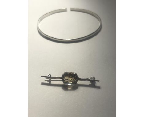 TWO SILVER ITEMS TO INCLUDE A BANGLE AND A PIN BROOCH 