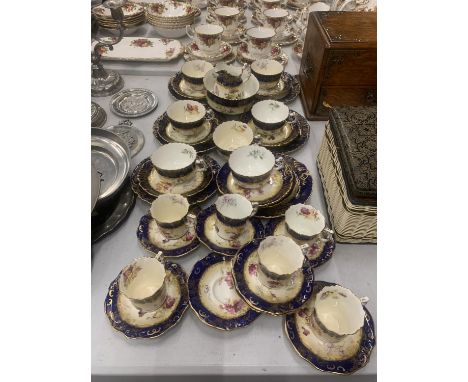 AN ANTIQUE CHINA TEASET TO INCLUDE A SUGAR BOWL, CREAM JUG, CUPS, SAUCERS, AND SIDE PLATES 