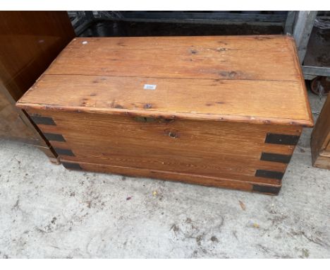 A VICTORIAN PINE METAL BOUND TRUNK, 35" WIDE 