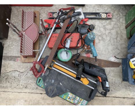 AN ASSORTMENT OF TOOLS TO INCLUDE A DRILL, A MITRE SAW AND A SPIRIT LEVEL ETC 