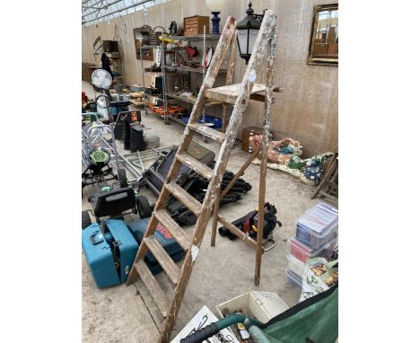 A VINTAGE SIX RUNG WOODEN STEP LADDER 