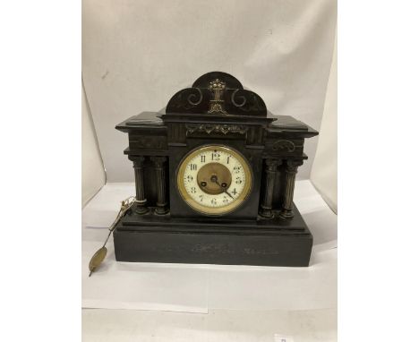 A VICTORIAN SLATE CHIMING MANTLE CLOCK WITH PENDULUM AND KEY 