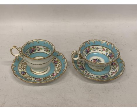 A PAIR OF CONTINENTAL PORCELAIN TURQUOISE AND GILT DESIGN CUPS AND SAUCERS 