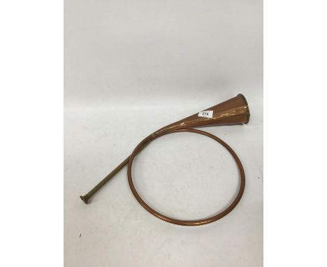 A VINTAGE COILED COPPER HUNTING HORN 