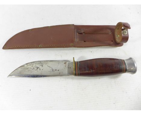 A BLACK EAGLE KNIFE AND SCABBARD, 12CM BLADE, LENGTH 23CM 