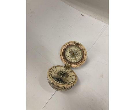 A VINTAGE BONE GLOBE COMPASS 