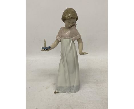 A NAO FIGURE OF A GIRL HOLDING A CANDLE 