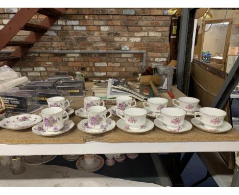 A COLLECTION OF BONE CHINA CUPS AND SAUCERS 