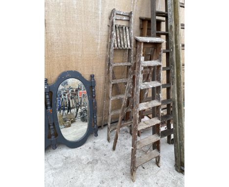 TWO VINTAGE WOODEN STEP LADDERS TO INCLUDE A SIX RUNG AND A FIVE RUNG 