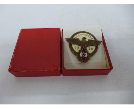 A BOXED WORLD WAR II NAZI GERMANY KREISSIEGER 1938 METAL AND ENAMEL BADGE 