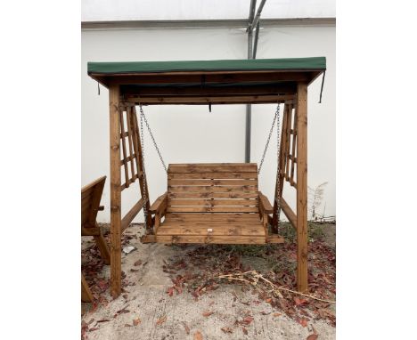 AN AS NEW EX DISPLAY CHARLES TAYLOR TWO SEATER SWING SEAT BENCH, WITH CANOPY TOP *PLEASE NOTE VAT TO BE CHARGED ON THIS ITEM*
