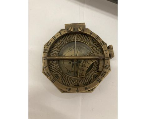 A BRASS COMPASS WITH FRENCH ADDRESS INSCRIPTION TO REVERSE 