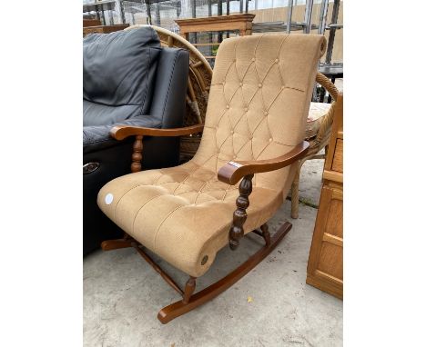 A MODERN BUTTON BACK ROCKING CHAIR 