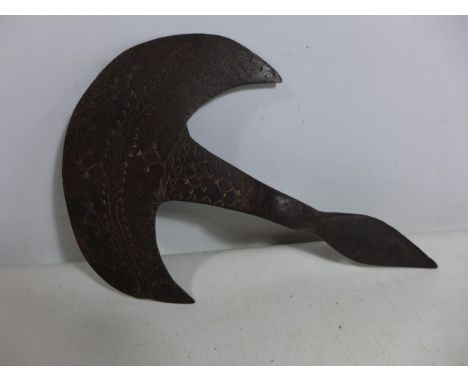 AN AXE HEAD WITH INCISED DECORATION, POSSIBLY AFRICAN, HEIGHT 15.5CM, LENGTH 23.5CM 