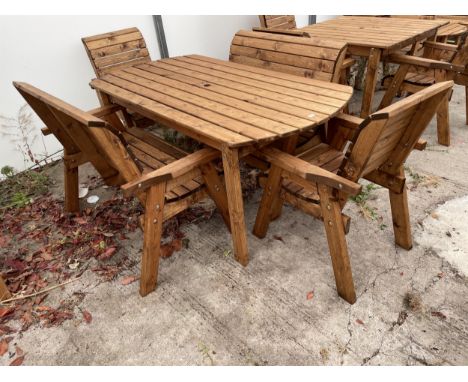 AN AS NEW EX DISPLAY CHARLES TAYLOR PATIO FURNITURE SET COMPRISING OF A LARGE RECTANGULAR TABLE, TWO CHAIRS AND A PAIR OF TWO