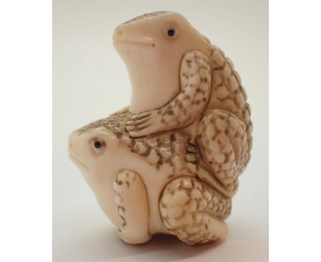 Antique ivory netsuke of two toads 