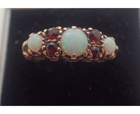 9ct gold opal and garnet ring size N 3.5g  CONDITION REPORT: Ring is undamaged