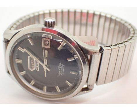 CITIZEN gents steel cased Crystal Seven automatic wristwatch having baton chapters against a black dial with day and date ape
