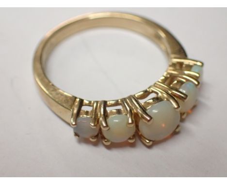 9ct gold five opal ring size K / L 2.4g   CONDITION REPORT: Ring is undamaged