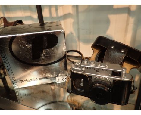 Cased Zorki UK camera Russian and a boxed Polaroid camera 