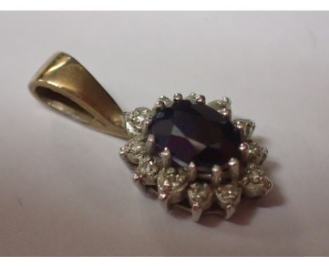 Small 9ct gold ruby and diamond set pendant 