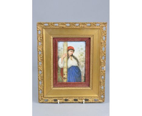 A 19TH CENTURY CONTINENTAL PORCELAIN PLAQUE OF A GIRL LEANING AGAINST A SILVER BIRCH TREE, wearing red head scarf, gold hoop 