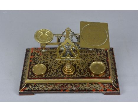 A SET OF VICTORIAN S. MORDAN & CO DESK POSTAGE SCALES, the boulle marquetry base fitted with six brass weights ranging from 1