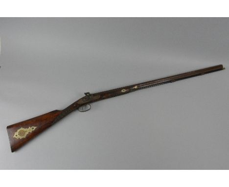 AN ANTIQUE 33 BORE 31 3/4'' DAMASCUS SINGLE BARREL PERCUSSION SMOOTH BORE GUN, bearing the name Rabone Bros & Co, it is marke