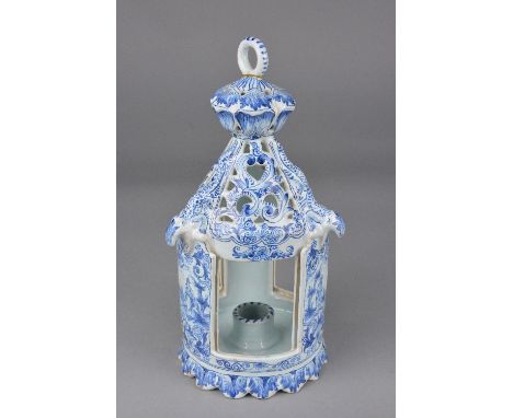 A DUTCH DELFTWARE TABLE LANTERN, ring handle (glued) above a pierced top with moulded lizards, the three open sides with slot