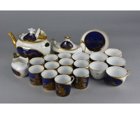 AN EARLY 19TH CENTURY ENGLISH BONE CHINA PART TEA AND COFFEE SERVICE, decorated with printed gilt landscapes of castles, hous